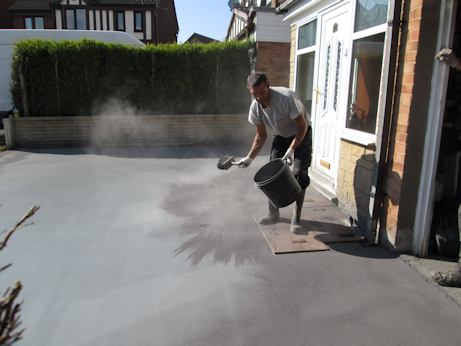 Texture mats being placed on the concrete